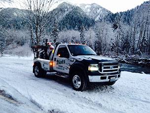Dick's Towing in the snow. Light duty tow truck 4x4